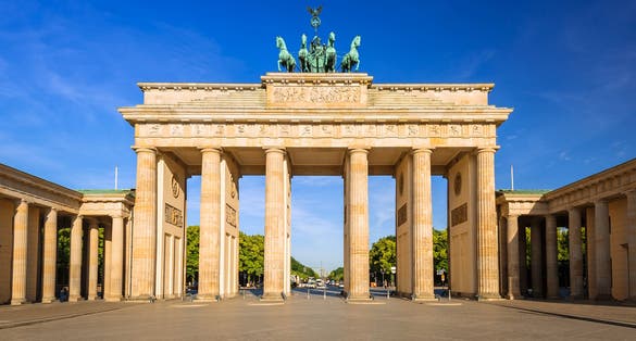 Photo of the Brandenburg Gate in Berlin at sunrise, Germany.