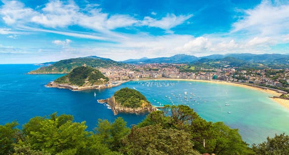 Photo of panoramic aerial view of San Sebastian (Donostia) in a beautiful summer day, Spain.
