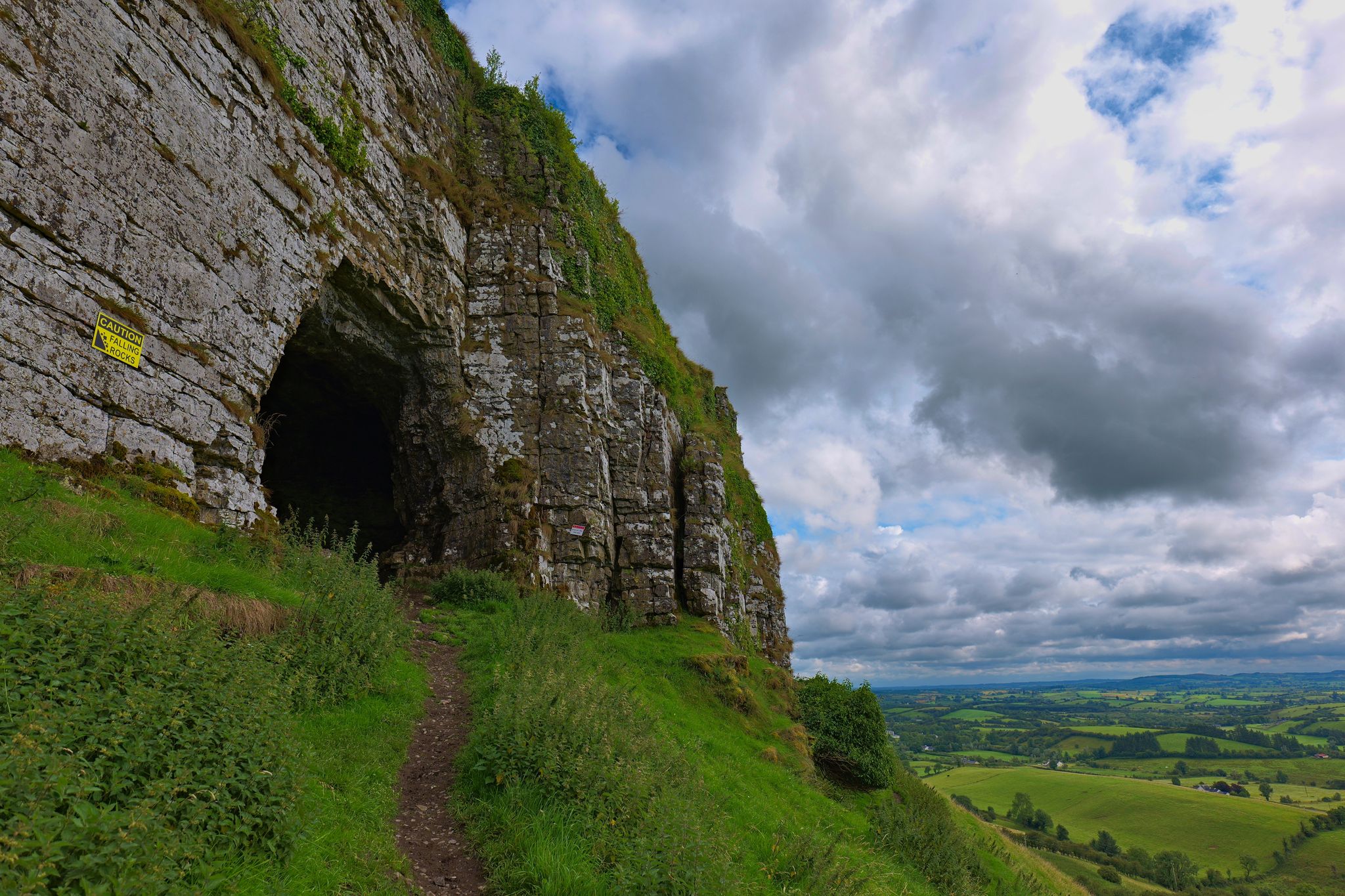photo of Entrance to the Caves of Kersh, overlooking the green rural landscape of County Sligo, Ireland .