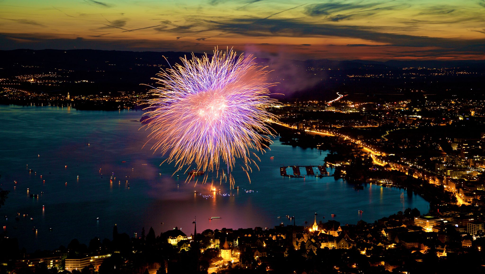 photo of fireworks in the lake Zug view from Zugerberg at night in Switzerland.