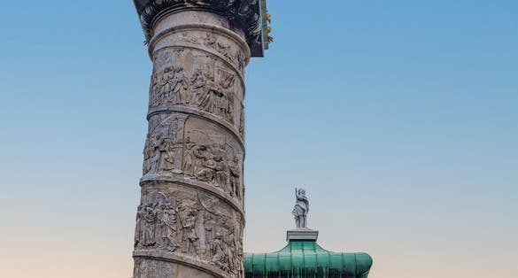 Photo of Pillar or the Historic Baroque church Karlskirche church in Karlsplatz in Vienna, Austria.