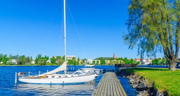  Photo of view of lake, pier and boats in Savonlinna, Finland.