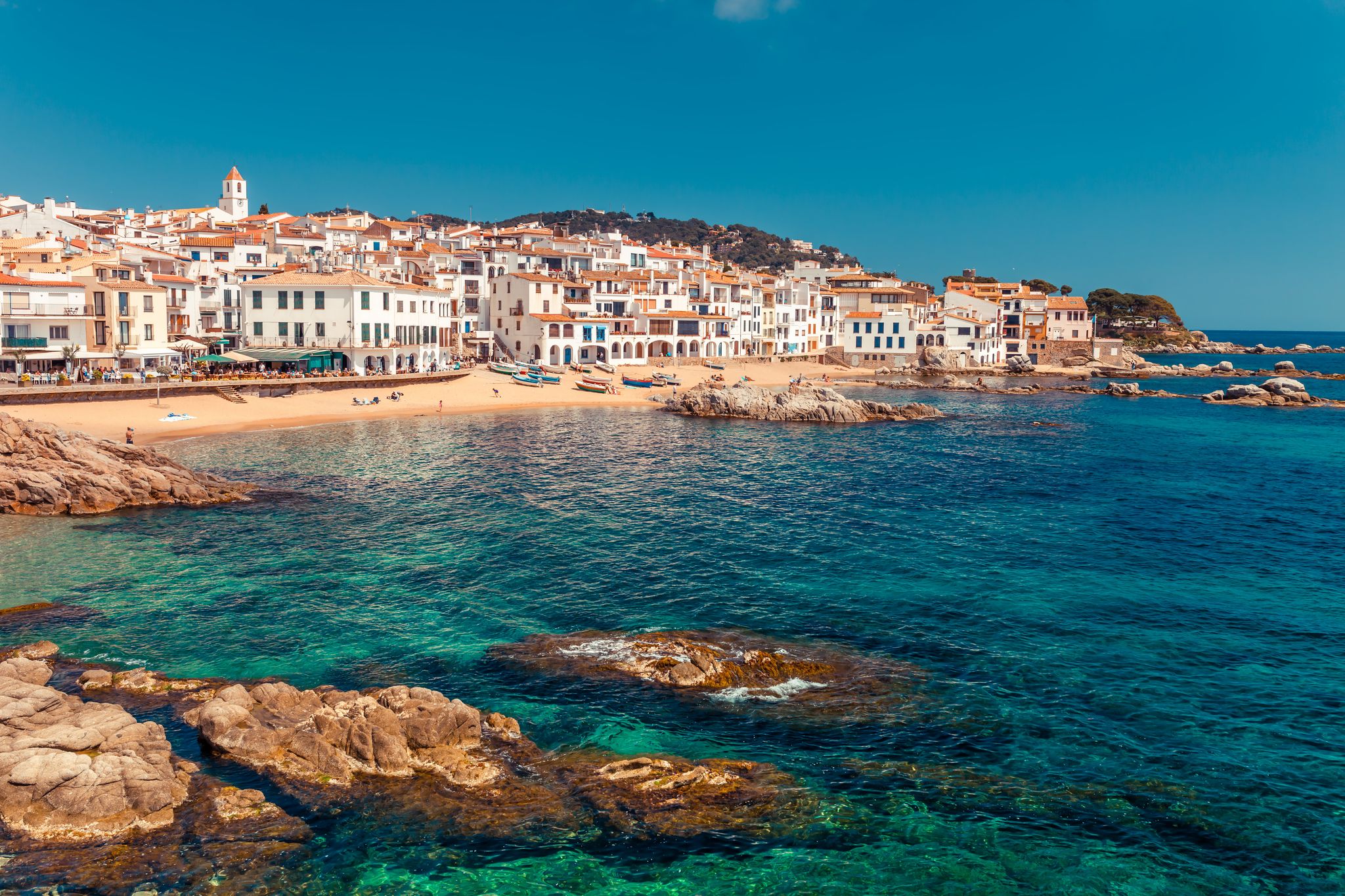 photo of sea landscape with Calella de Palafrugell, Catalonia, Spain near of Barcelona. Scenic fisherman village with nice sand beach and clear blue water in nice bay. Famous tourist destination in Costa Brava.