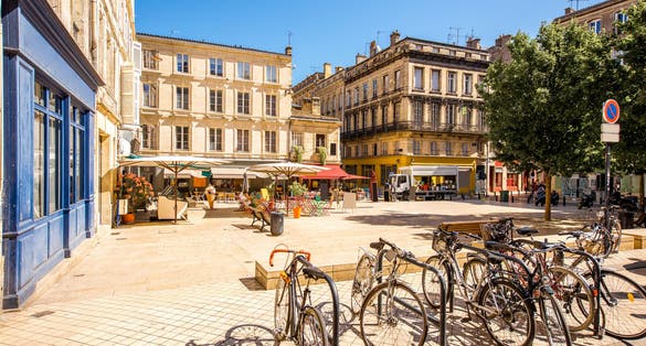 View on the small square with bicycles in Bordeaux city in France