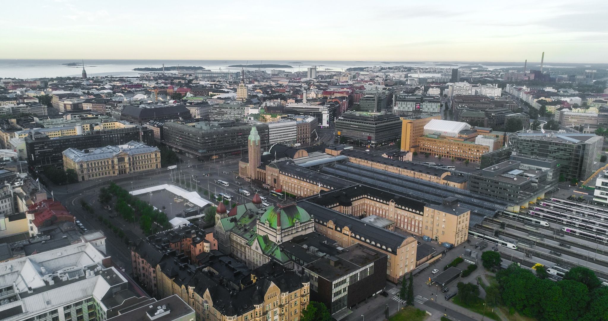 photo of an aerial view of the Railway station in the city of Helsinki, on a summer dawn in Finland.