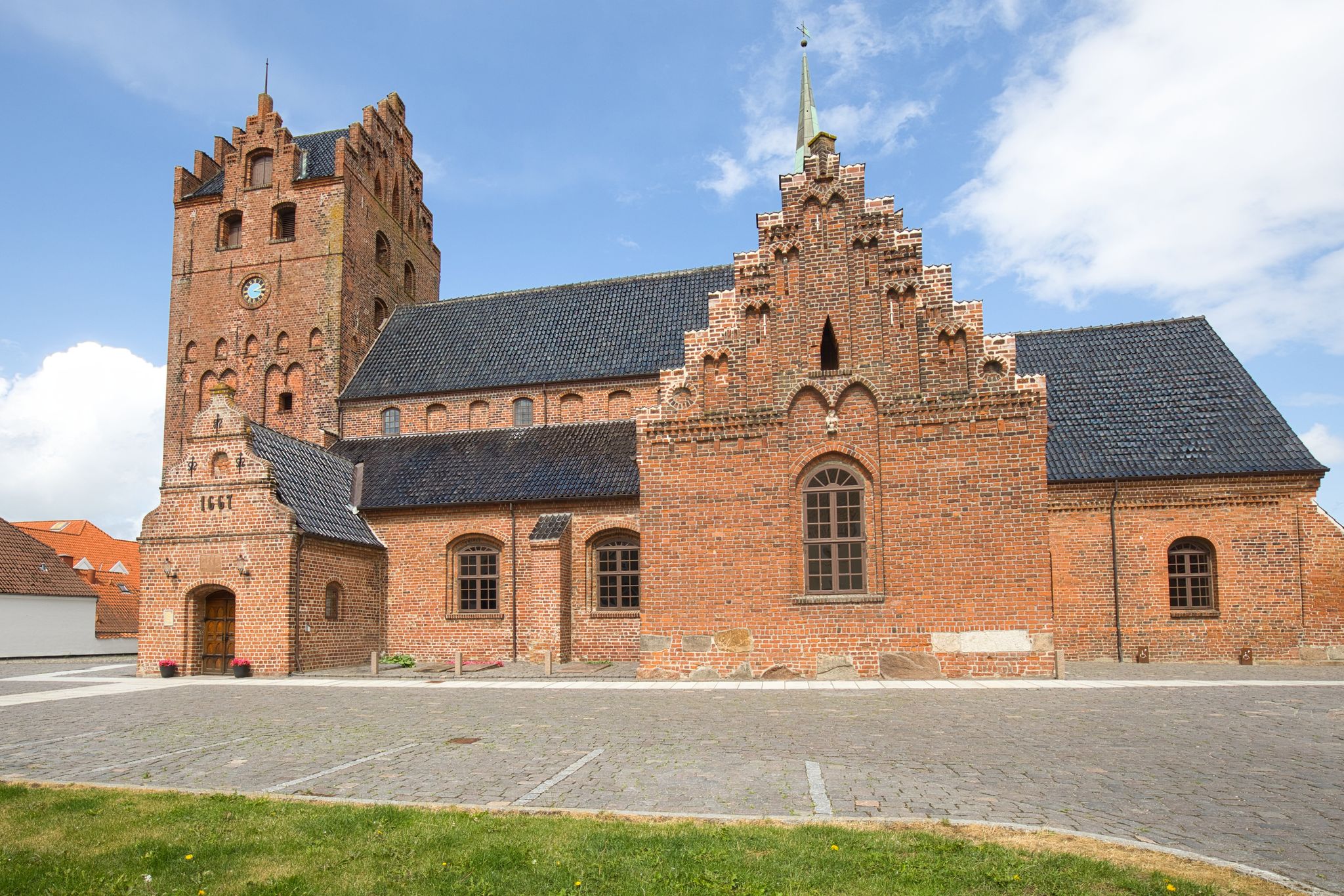photo of view of Sankt Nikolaj Church is a red brick building in the town of Middelfart in Denmark.