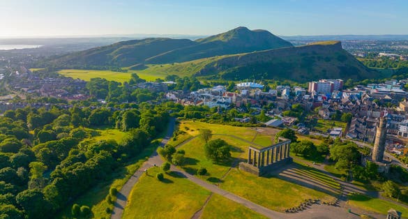 Holyrood Park and Holyrood Palace aerial view from Calton Hill in Edinburgh, Scotland, UK. Old town Edinburgh is a UNESCO World Heritage Site since 1995.