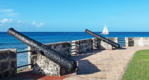 photo of view ofVintage canons line the ramparts at the Charles Fort in Bridgetown Barbados, Kinsale, Irland.