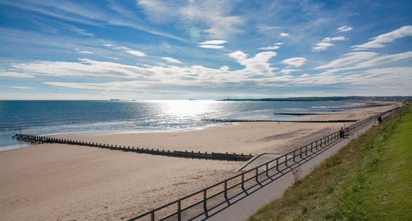Photo of Aberdeen beach on a sunny afternoon.