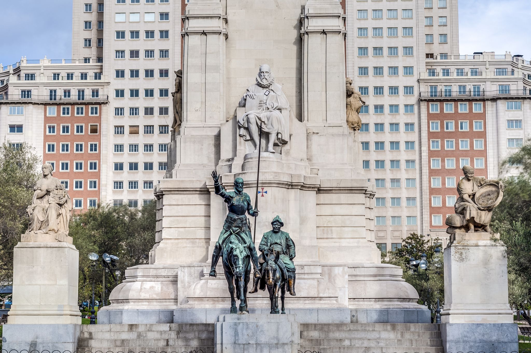 Photo of Spain Square, the popular tourist destination at the western end of the Gran Via avenue features a monument to Miguel de Cervantes Saavedra in Madrid, Spain.
