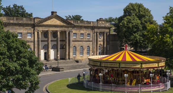 Photo of the York Castle Museum and a Merry-go-round in the historic city of York, England.