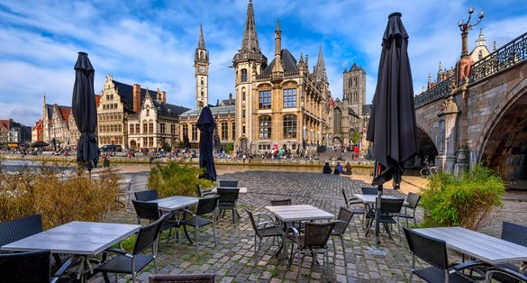 View of Graslei, Korenlei quays and Leie river in the historic city center in Ghent (Gent), Belgium. Architecture and landmark of Ghent. Sunset cityscape of Ghent.