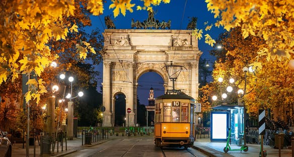 photo of view of View of the Peace Arch with yellow tram in Milan, Italy