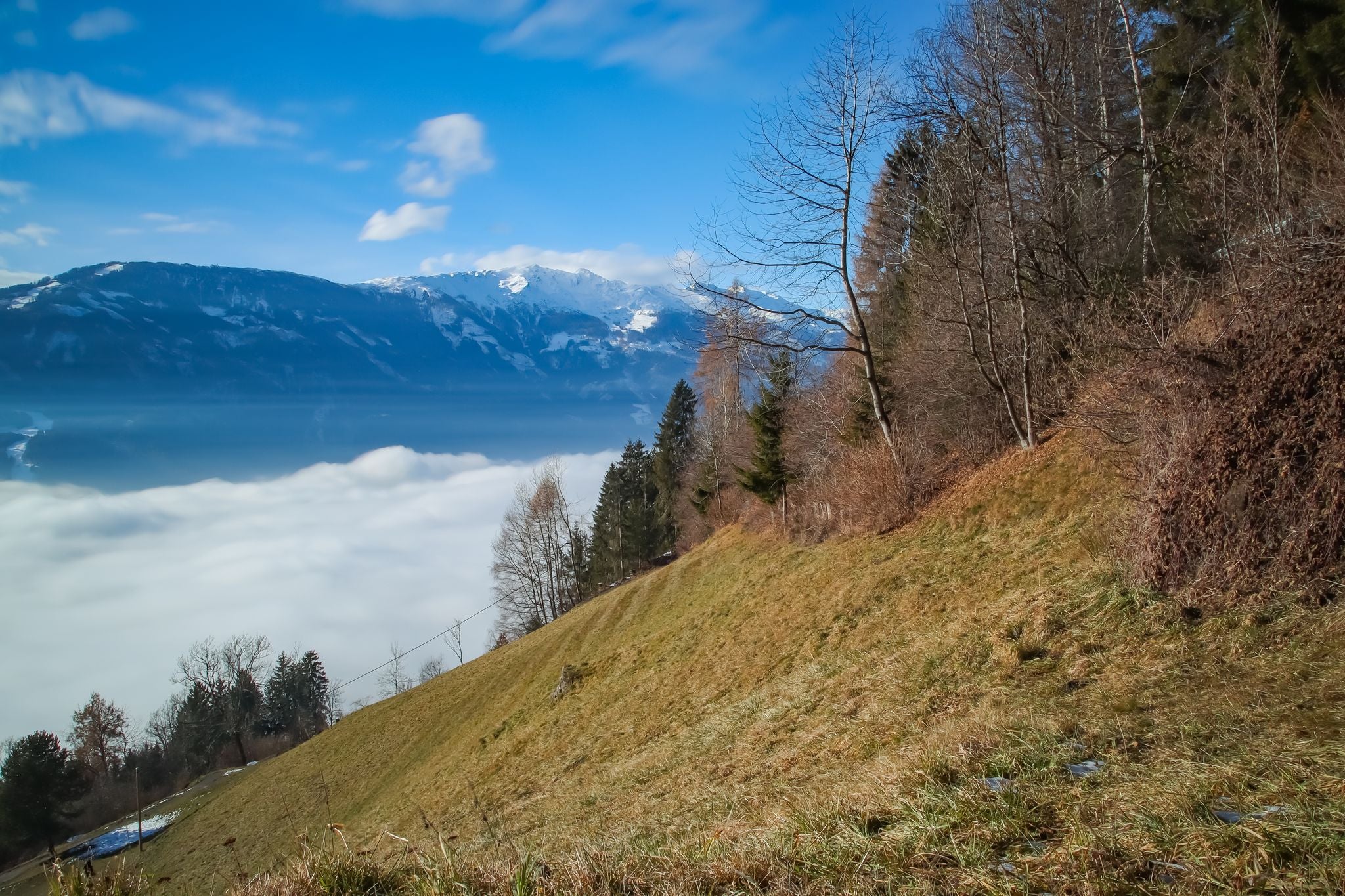 PHOTO OF VIEW OF Lienz covered by fog, sun shines on the fog, Lienzer Dolomites