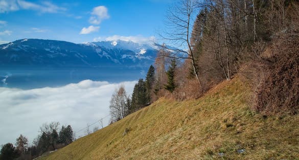 PHOTO OF VIEW OF Lienz covered by fog, sun shines on the fog, Lienzer Dolomites