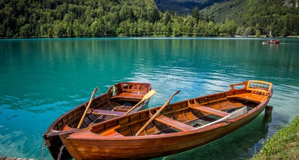 Boats at the pier of the Bled Island, Lake Bled, Slovenia.