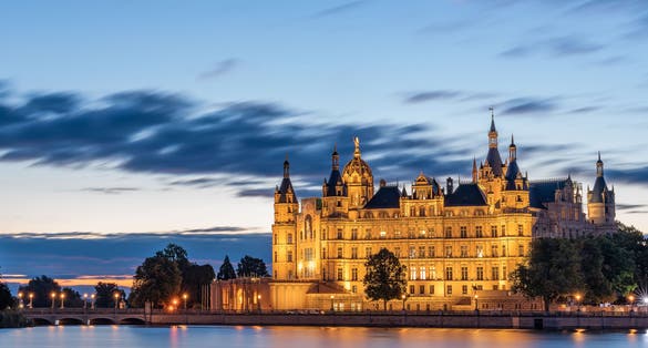 Schwerin Castle flooded with light in the morning hours.