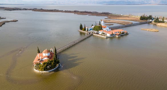 photo of aerial drone view of Agios Nikolaos Monastery on the Vistonida Lake at Porto Lagos, Xanthi, Greece.