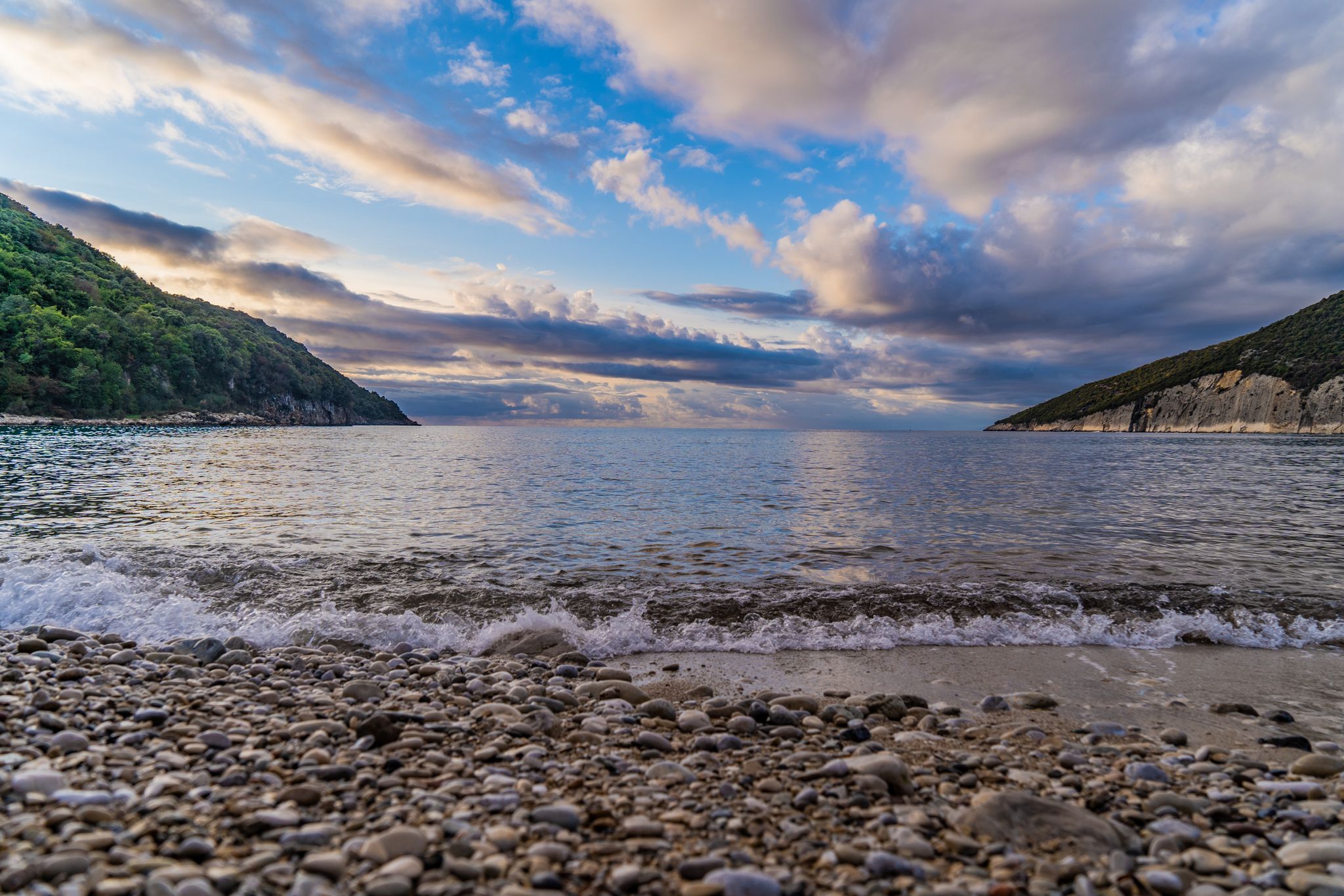 Photo of Valdanos beach at very beautiful sunset near Ulcinj, Montenegro. Beautiful bay with transparent water and breathtaking landscapes.