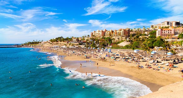 Photo of El Duque beautiful beach and coastline with blue sky in Tenerife. Adeje coast Canary island, Spain