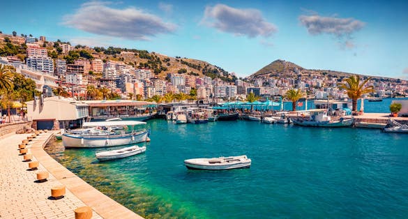 Perfect spring cityscape of Saranda port. Picturesque Ioninian seascape. Bright morning scene of Albania, Europe. Traveling concept background.
