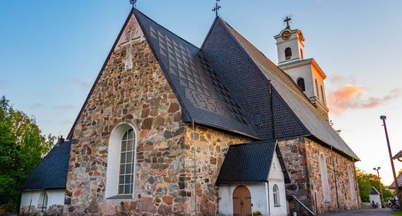 Sunset of Church of the Holy Cross in Finnish town Rauma.