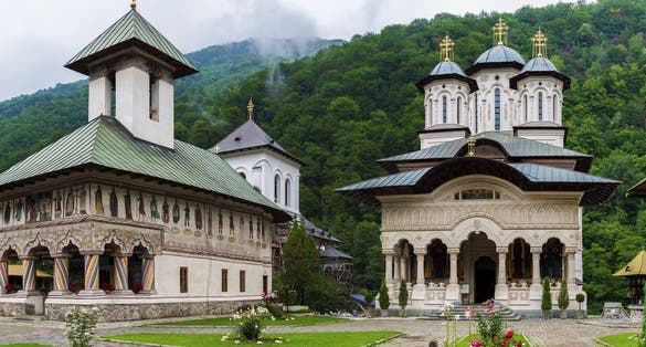 Photo of Lainici Monastery, called "Bride of the gorge" , due of its strong white facade is an orthodox monastery in Targu Jiu ,Gorj County, Romania .