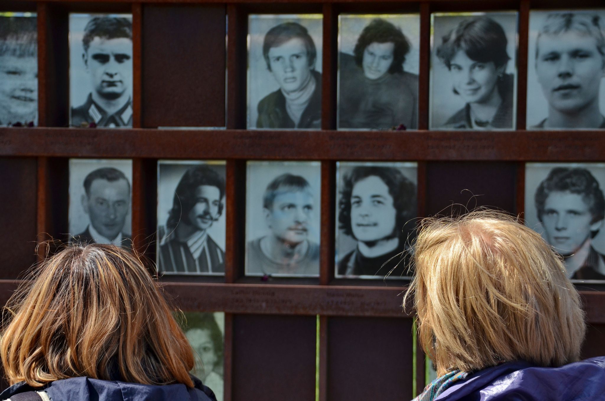 Photo of Berlin wall memorial with deceased people photograph, Germany.