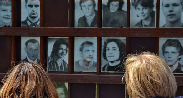 Photo of Berlin wall memorial with deceased people photograph, Germany.