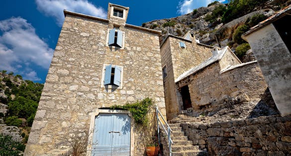 Photo of Pustinja Blaca hermitage on the rock, island of Brac, Dalmatia, Croatia.