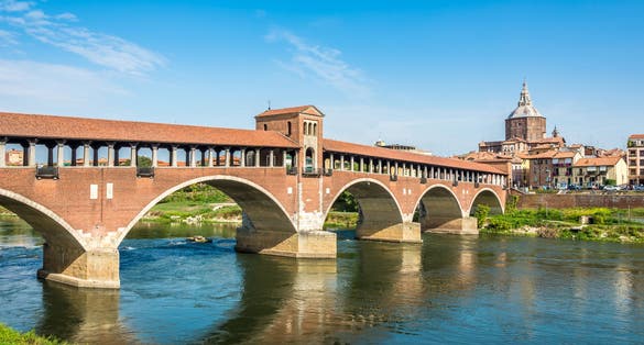 Ponte coperto ( covered bridge ) or Ponte Vecchio over Ticino river in Pavia, Lombardy, Italy
