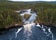 An aerial view of Kiutaköngäs rapids in the northern taiga forest of Finland.