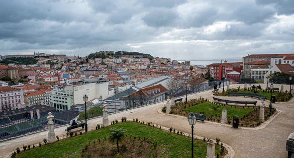 Landscaped terrace of viewpoint de São Pedro de Alcântara with panoramic views of Lisbon.