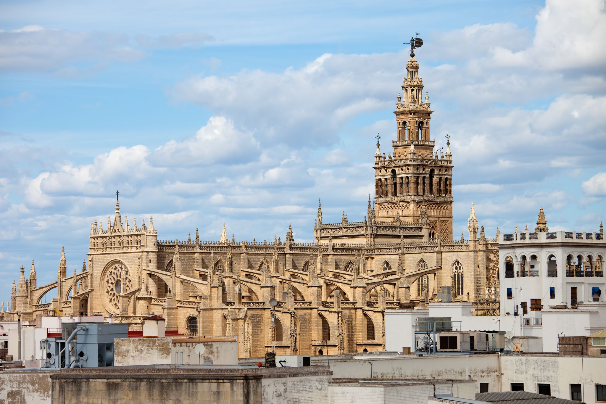 Photo of aerial view of Cathedral of Seville (Spanish: Catedral de Santa Maria de la Sede) Gothic architecture in Seville, Andalusia, Spain.