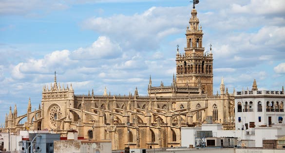 Photo of aerial view of Cathedral of Seville (Spanish: Catedral de Santa Maria de la Sede) Gothic architecture in Seville, Andalusia, Spain.
