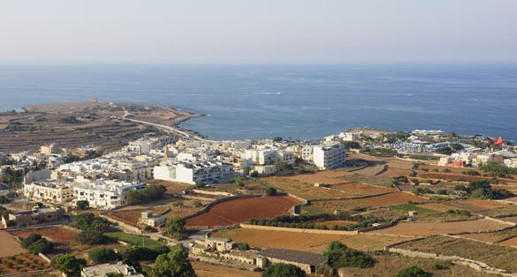photo of view of Panoramic view of In-Naxxar coast wih Saint Mark's Tower from Top Of The World panoramic viewpoint. Gharghur. Malta.