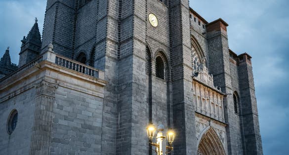 photo of Ávila Cathedral at night in Avila, Spain.