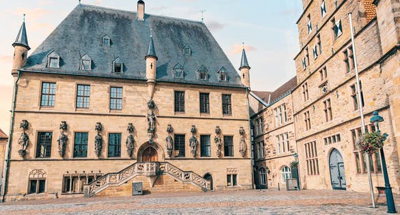 Photo of Beautiful Gothic city hall or Rathaus building in Osnabruck, Lower Saxony in Germany. Tourist and architectural attraction.