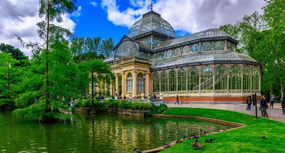 Photo of crystal Palace (Palacio de cristal) in Retiro Park in Madrid, Spain.