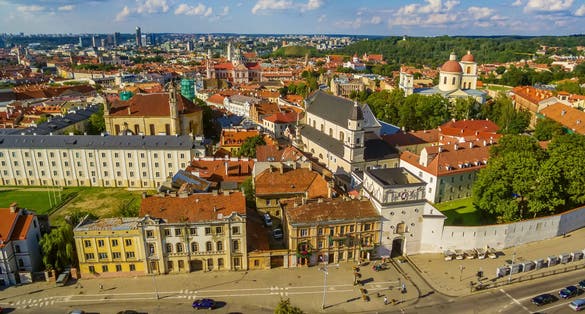 photo of aerial top view of old town in vilnius, Lithuania: the gate of dawn (Lithuanian: Ausros, Medininku vartai). The gate of dawn is one of the most important religious, historical and cultural monuments.