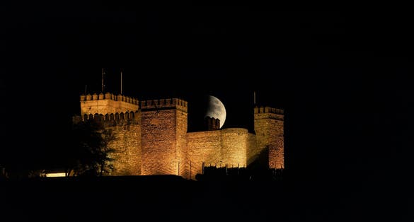 photo of night view of medieval Castillo de Cortegana in Huelva, Spain.