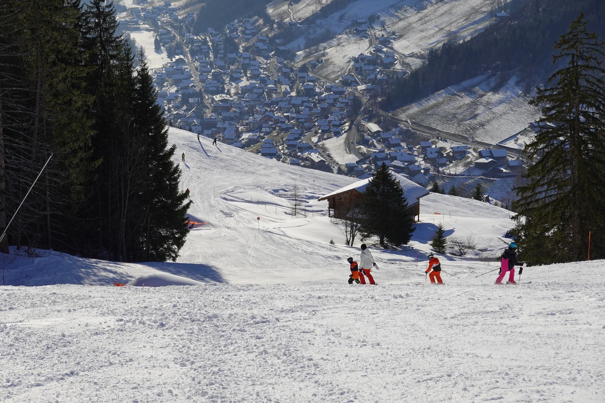 photo of Annecy city center panoramic aerial view with the old town, castle, Thiou river and mountains surrounding the lake, beautiful summer vacation tourism destination in France, Europe.