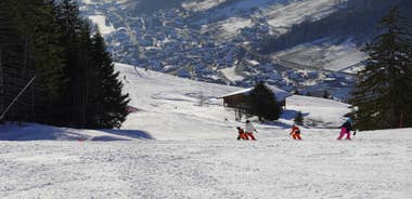 photo of Annecy city center panoramic aerial view with the old town, castle, Thiou river and mountains surrounding the lake, beautiful summer vacation tourism destination in France, Europe.