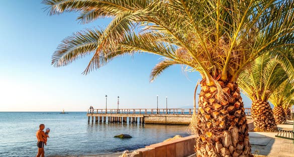 Sea view and sandy beach in The Paralia, a tourist seaside part of the municipality Katerini, Greece, Europe.