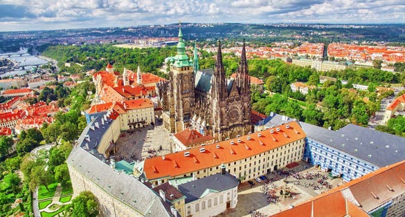 Photo of aerial view of Prague Castle and St. Vitus Cathedral under clear Blue sunny sky ,Czech.