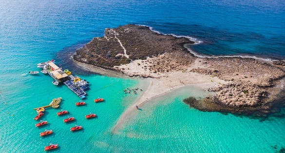 Nissi beach in Ayia Napa, clean aerial photo of famous tourist beach in Cyprus, the place is a known destination on island and is formed from a smaller island just near the main shore