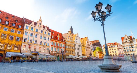 Fantastic view of the ancient homes on a sunny day. Gorgeous picture and picturesque scene. Location famous Market Square in Wroclaw, Poland, Europe. Historical capital of Silesia. Beauty world.