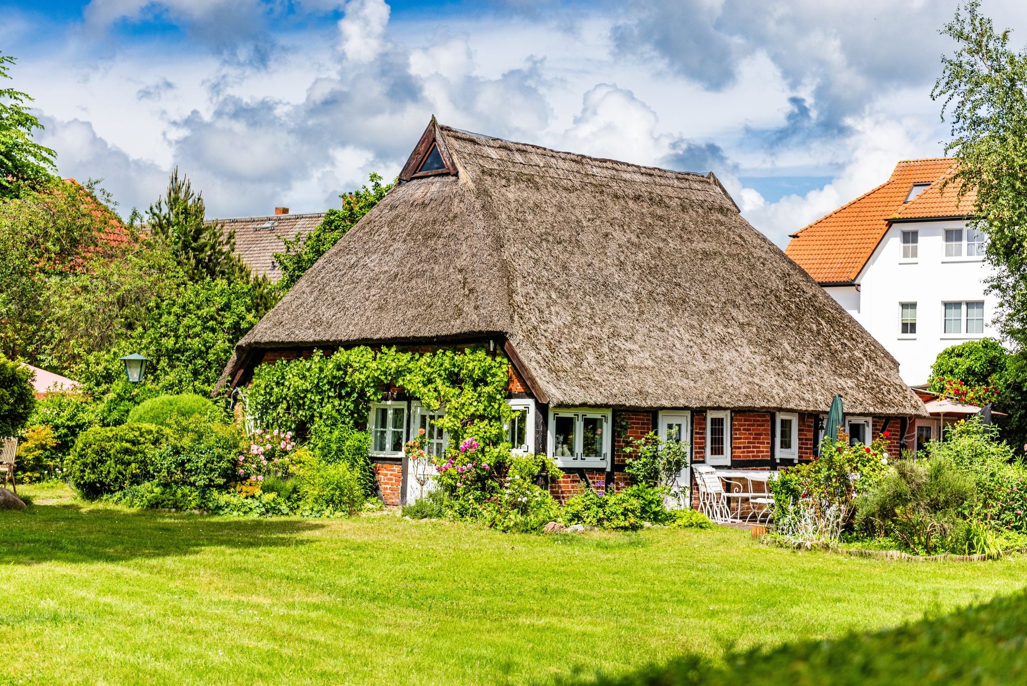 photo of view of Historic thatched house in the center of Zingst, Mecklenburg-Vorpommern, Germany.