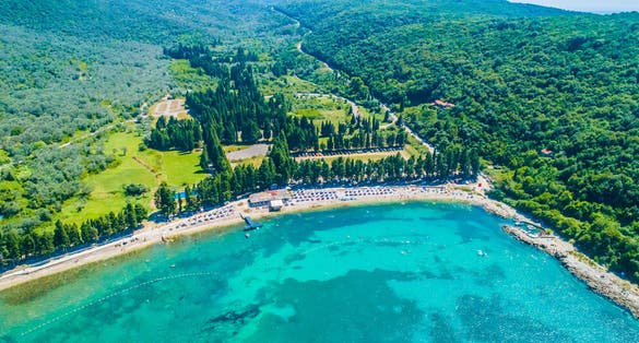 Photo of aerial view of Valdanos beach near Ulcinj, Montenegro. Beautiful bay with transparent water and breathtaking landscapes.