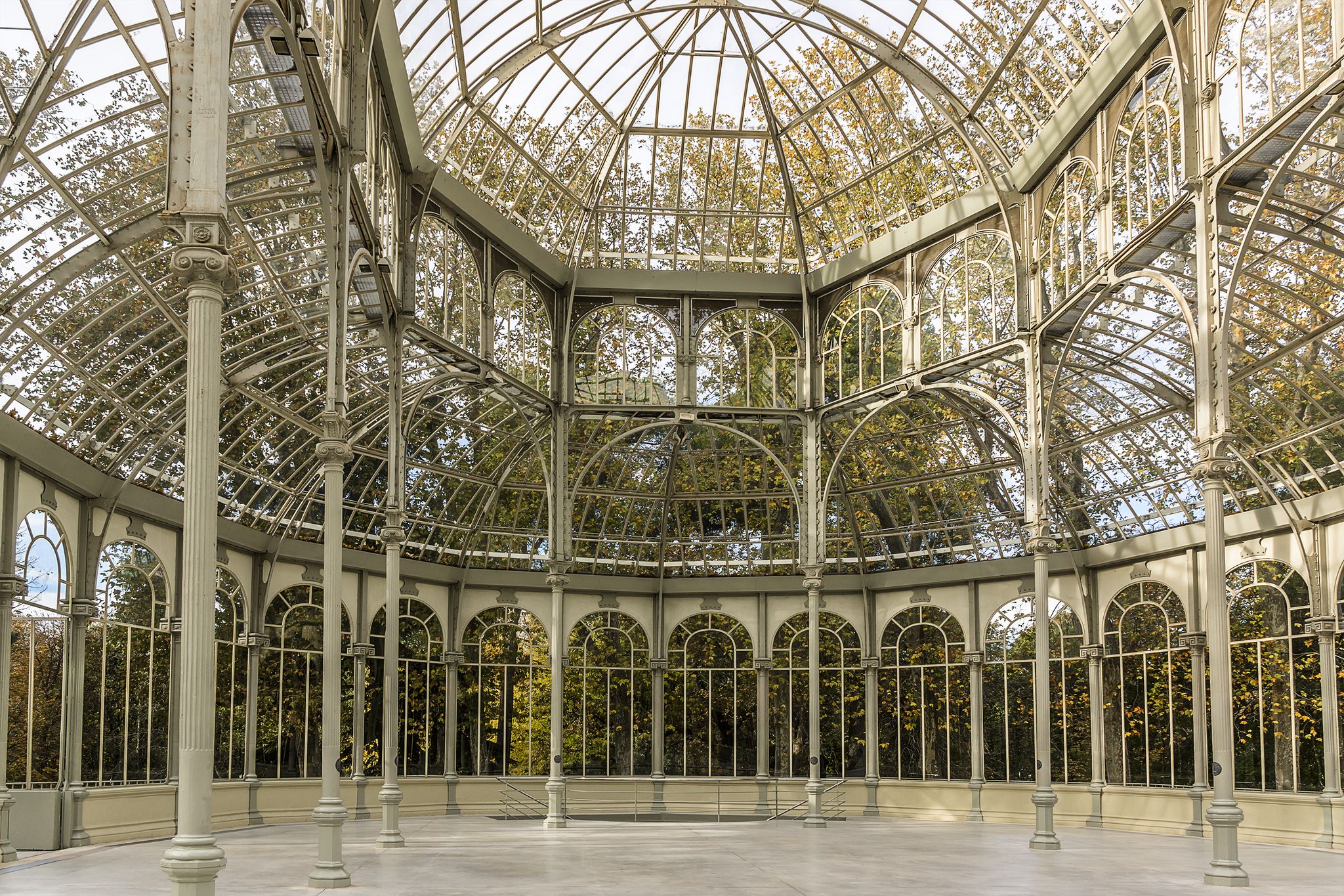 Photo of Crystal Palace (Palacio de cristal) in the Retiro Park in Madrid. Spain. It was built in 1887 to exhibit flora and fauna from the Philippines. 